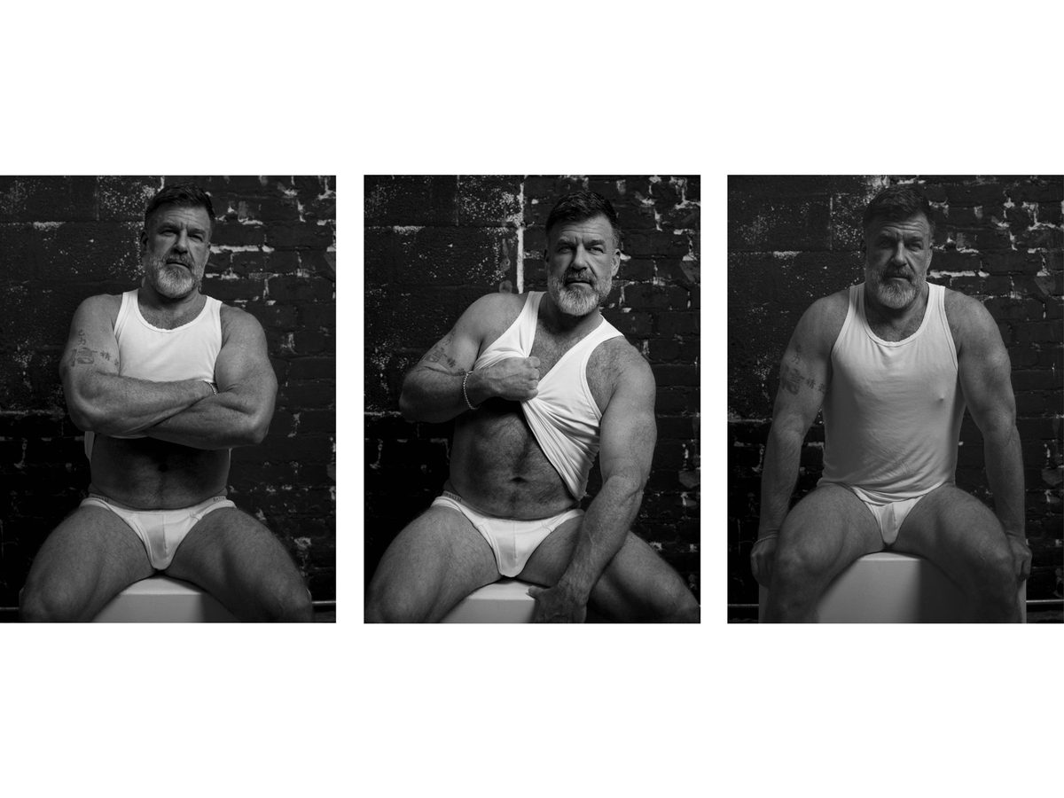Spread 3 of 8: three photographs of a bearded, grey-haired man in a tank top and briefs, seated on a white block; black and white.